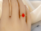 hand A 9 carat gold dress ring that features a vibrant fireglow fire opal. The bright orange colour is quite beautiful.