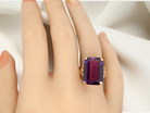 hand A 9 carat gold* dress ring that is set with a substantial amethyst gemstone.
