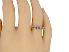 hand A 9 carat gold half hoop eternity ring. Set with five blue topaz gem stones, each 2.8mm.&nbsp;
