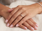 hand A 9 carat gold solitaire ring. Features a single white diamond 3.4mm (est 0.15 carats)
