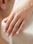 hands A 9 carat yellow gold wedding ring. D shape profile.

Width 4.2mm, weight 2.1grams.&nbsp;