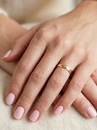 hand A 9 carat yellow gold wedding ring. D shape profile, with a width of 5mm.

 Weight 2.3grams.&nbsp;

UK hallmarks for 1991