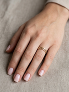 hand A Celtic design gold ring, could be used as a wedding ring, or just a ring for everyday wear.
