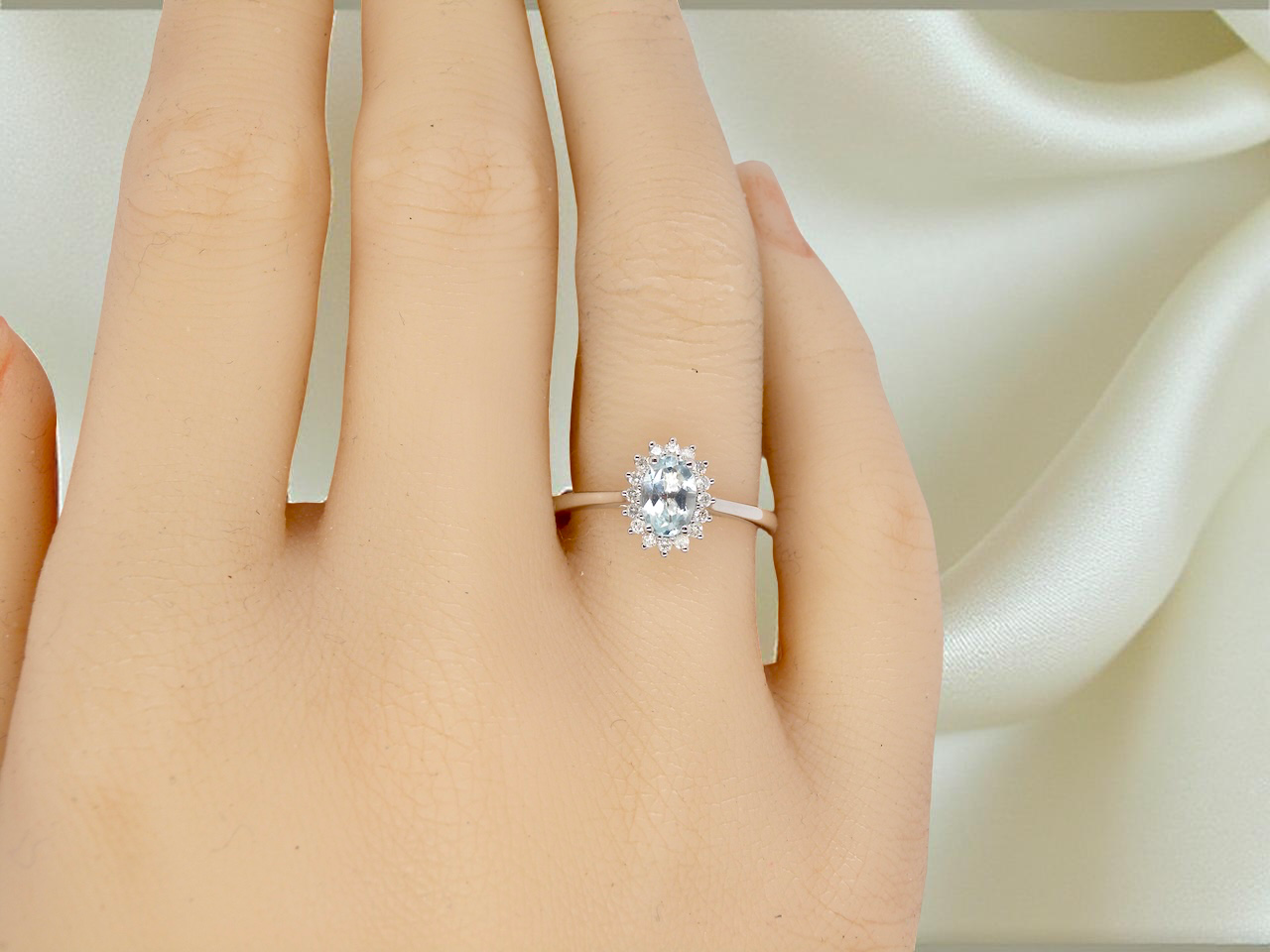 A NEW blue topaz and diamond ring