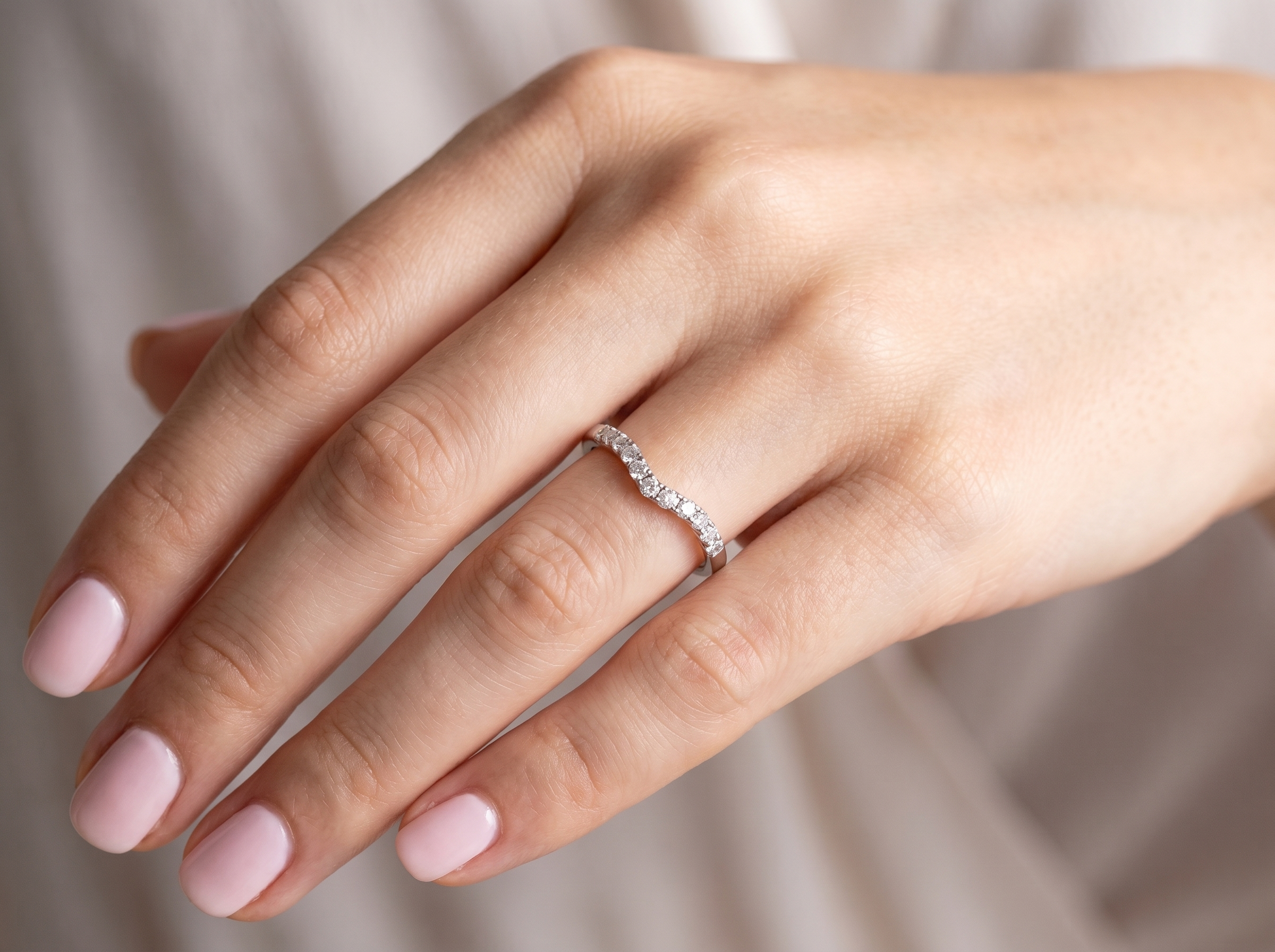 hand A Platinum half hoop ring featuring a gently contoured U-shaped centre, designed to allow a cluster or solitaire ring to sit comfortably alongside.