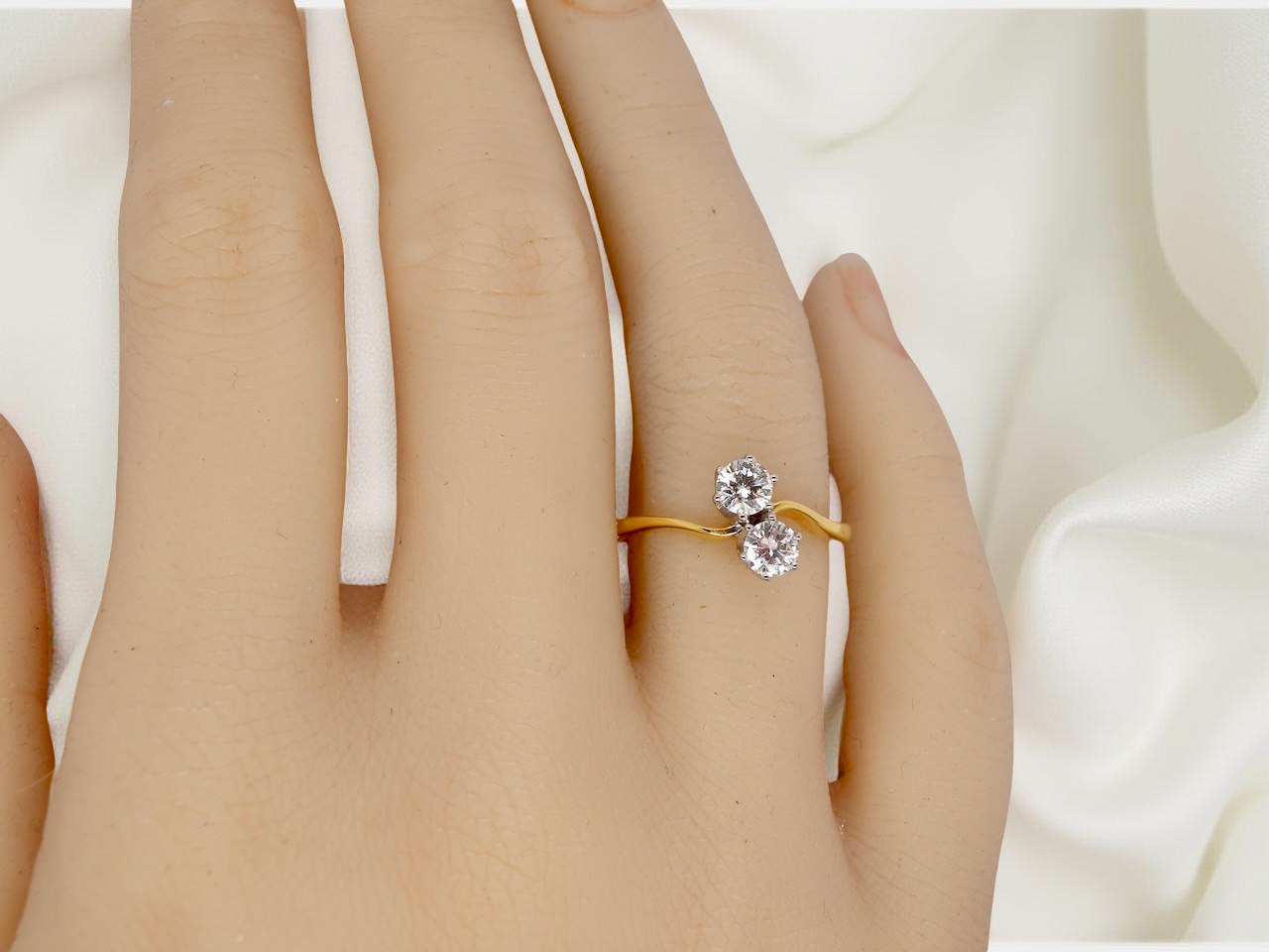 hand A beautifully balanced Moi et Toi ring featuring two sparkling modern brilliant-cut diamonds