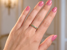 hand A brand new half hoop eternity ring. Set with eight 1.3mm emeralds (total 0.12 carats) and interspaced with brilliant cut white diamonds, each 1.3mm (0.10 carats)