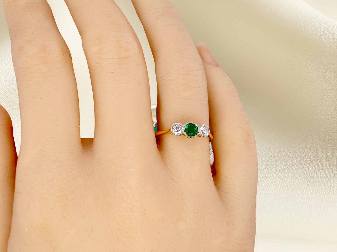 hand A charming ring dating from the early to mid-20th century, beautifully crafted and full of period character.

The centrepiece is a vivid bright-green, cushion-shaped emerald 