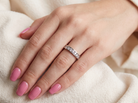 hand A classic 18 carat white gold half hoop diamond eternity ring, beautifully set with ten brilliant cut white diamonds.