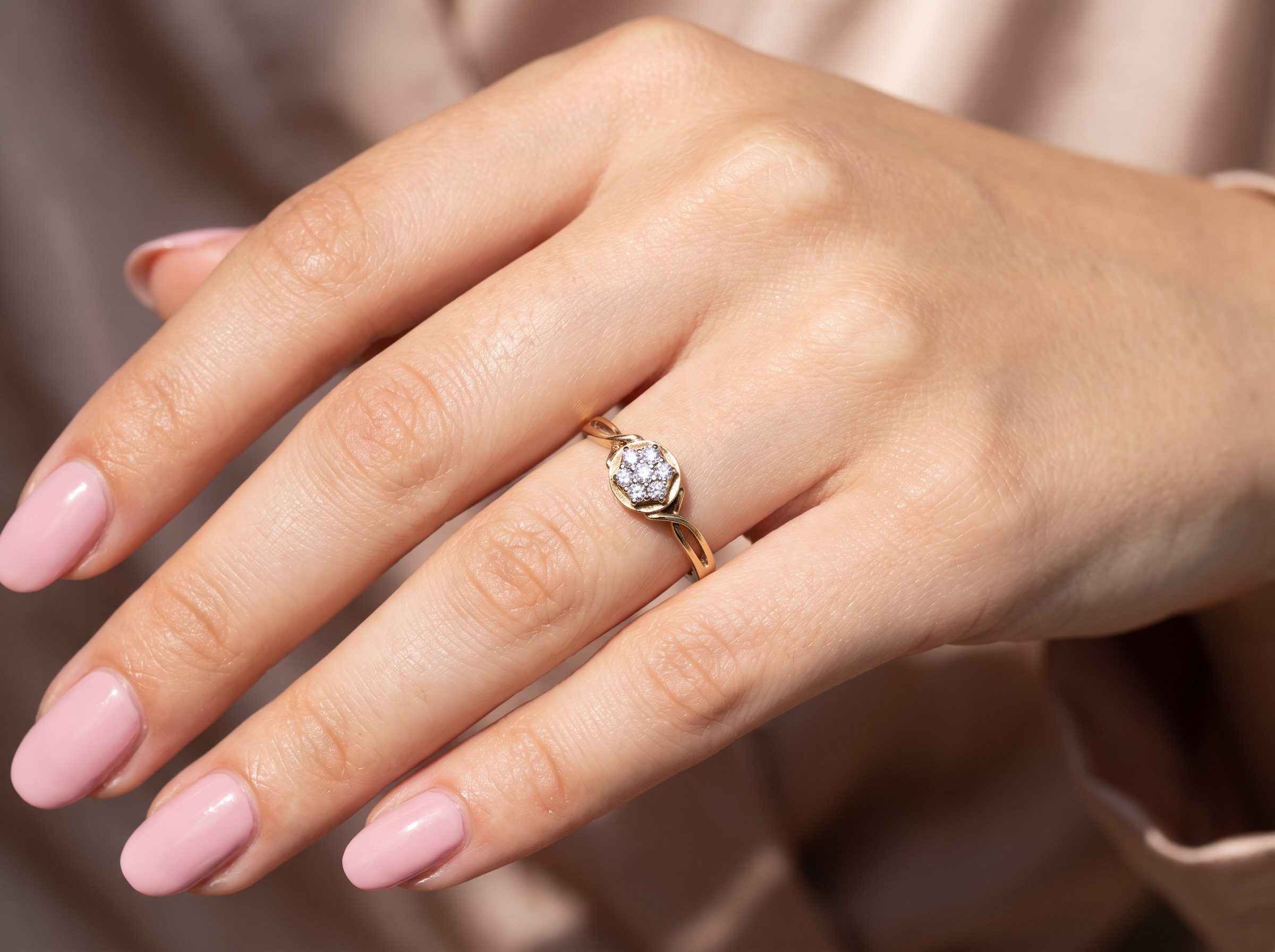 hand A classic 1980s cluster ring. Seven brilliant cut white diamonds , each 2.5mm (est 0.40 carats). Colour i-j, clarity Si. Claw set in white gold.