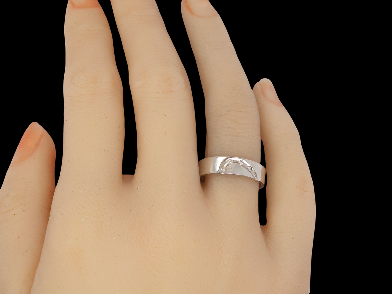 hand A classic 9 carat white gold ring with a timeless wedding-band style, equally suited to wear as a simple diamond dress ring. 