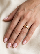 hand A fine 18 carat gold buckle ring set with small old rose cut diamonds