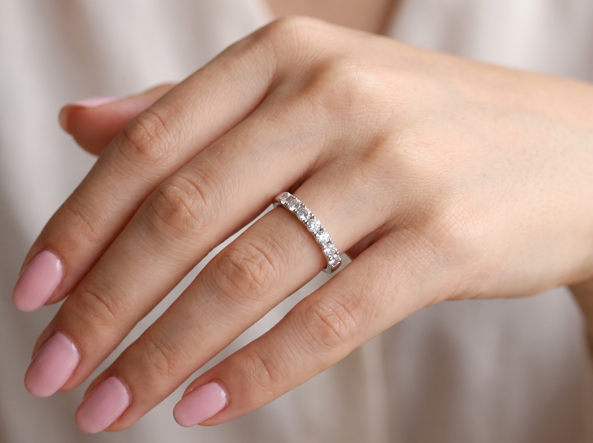 hand A fine seven stone half hoop platinum eternity ring, total measures 0.70 carats