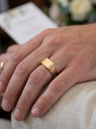 hand A gentleman's 9 carat gold signet ring. Rectangular shaped head, plain polished surface and suitable for initials to be engraved.