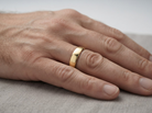 hand A gentleman's 9 carat gold wedding ring.

Width 6mm, plain D shape profile. Weight 2.9grams.&nbsp;