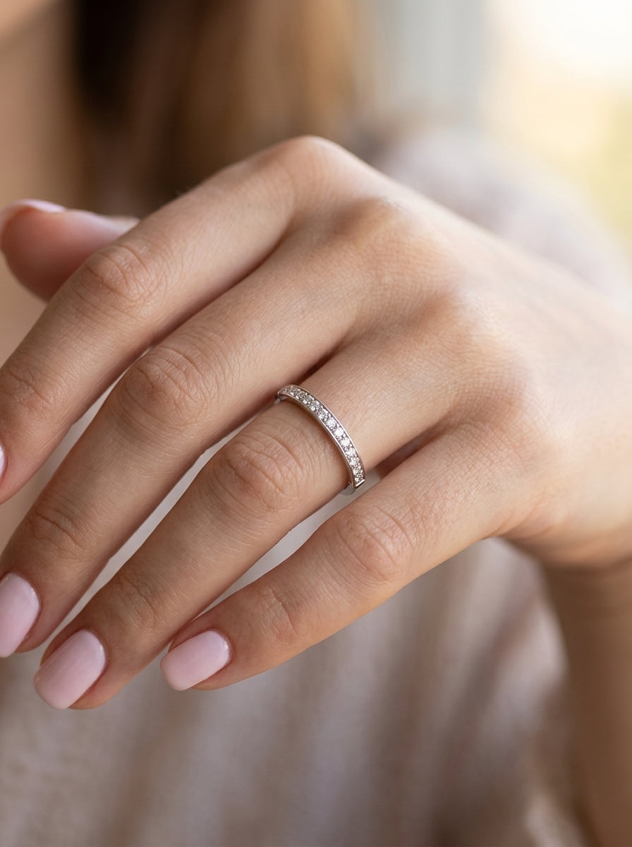 hand A half hoop eternity ring. Set with eleven small white diamonds, brilliant cut 2mm each (total est 0.33 carats) colour i-k, clarity Si.