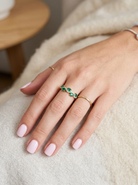 hand A half hoop ring with a very attractive line of oval cut emeralds, each 4x3mm, a lovely deep grass green hue, and with very good clarity too.
