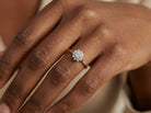 hand A lovely well proportioned cluster ring. Features to the centre a 5mm brilliant cut white diamond