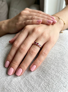 hand A pretty 9 carat gold dress ring. The three rubies are marquise cut, 5x3mm each, and set at an angle .