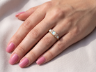 hand A pretty Victorian style ring. 18 carat gold. There are three&nbsp; opals, centre 6mm, each end 4x3mm. Good colour play