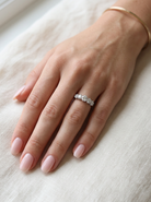 hand A stunning half hoop ring featuring five exceptional brilliant-cut white diamonds, expertly claw set in 18ct white gold.

The centre diamond measures approximately 5.8mm (estimated 0.70 carats), flanked by a 5.0mm diamond on each side, with 4.5mm diamonds at each end. 