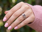 hand A stunning ring from the House of Le Vien. Crafted from 14ct Strawberry Gold, this Le Vian ring&nbsp; is characterised by a gallery of brown/white diamonds set into each shoulder