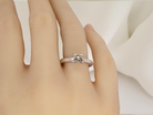 hand A timeless and beautifully crafted solitaire ring featuring a stunning 0.78 carat Princess-cut white diamond 