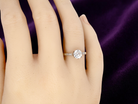 hand A timeless vintage solitaire ring set with a striking old brilliant cut white diamond. The central diamond measures approximately 6mm, estimated at 0.75 carat, with colour graded between G–I and clarity SI.