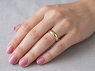 hand A traditional 9 carat gold wedding ring. 6mm width, D shape profile
