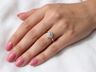 hand A traditional cluster ring. Features to the centre a 3.4mm brilliant cut white diamond (est 0.15 carats)

Surrounded by six 3.4mm diamonds to match