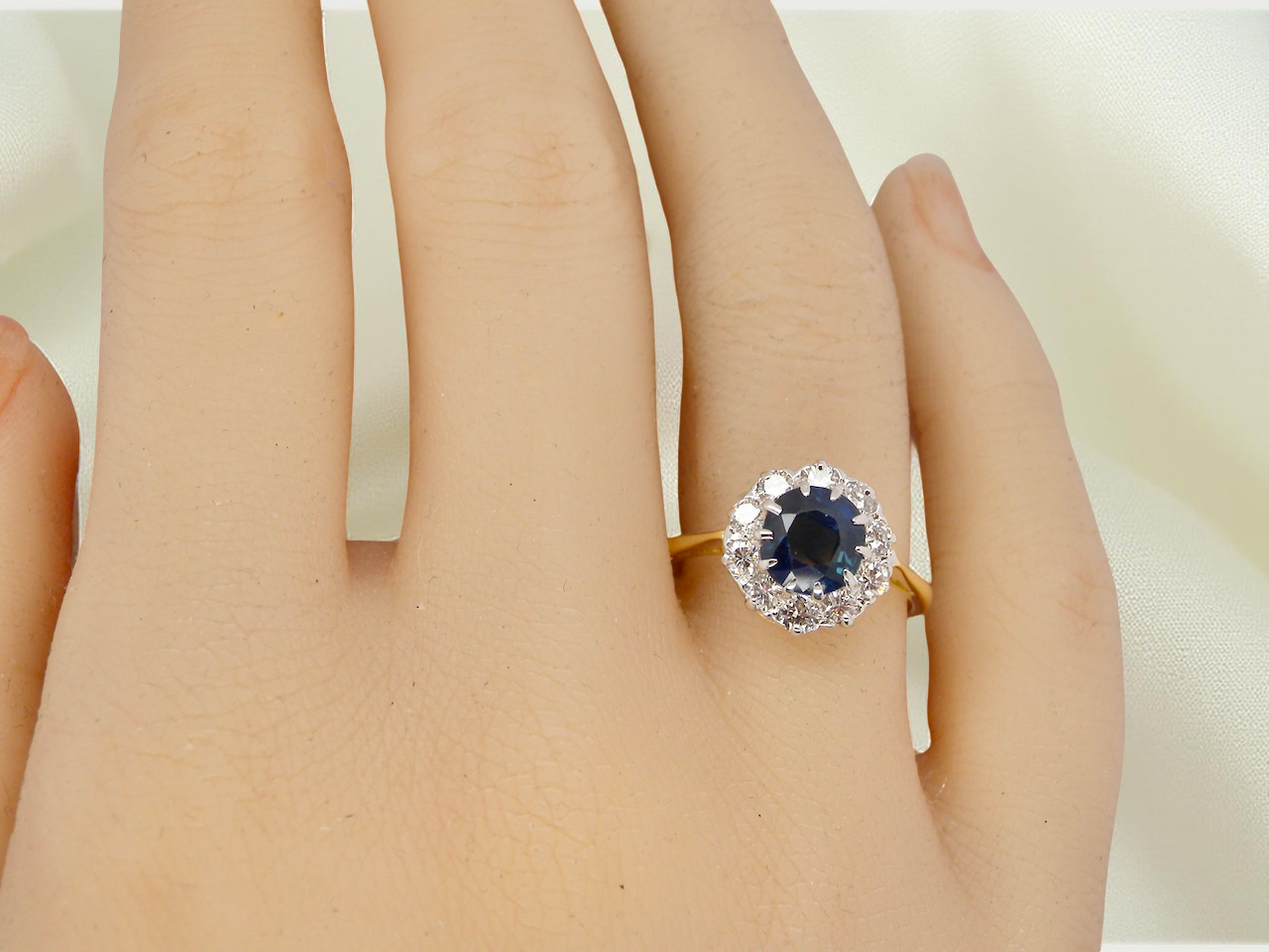 A traditional round cluster- Sapphire and Diamond