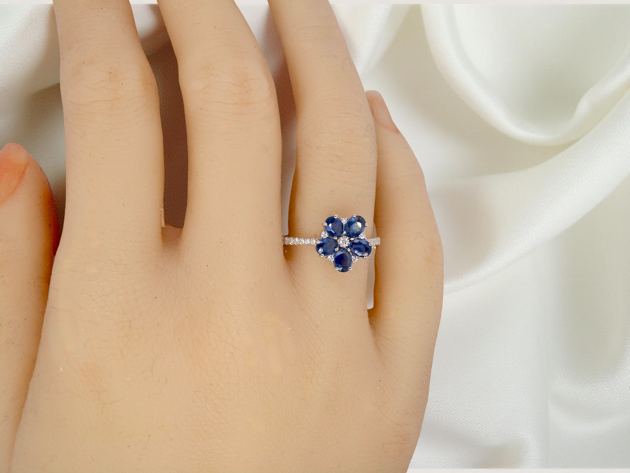 hand A very pretty cluster ring. Features six cornflower blue oval cut sapphires