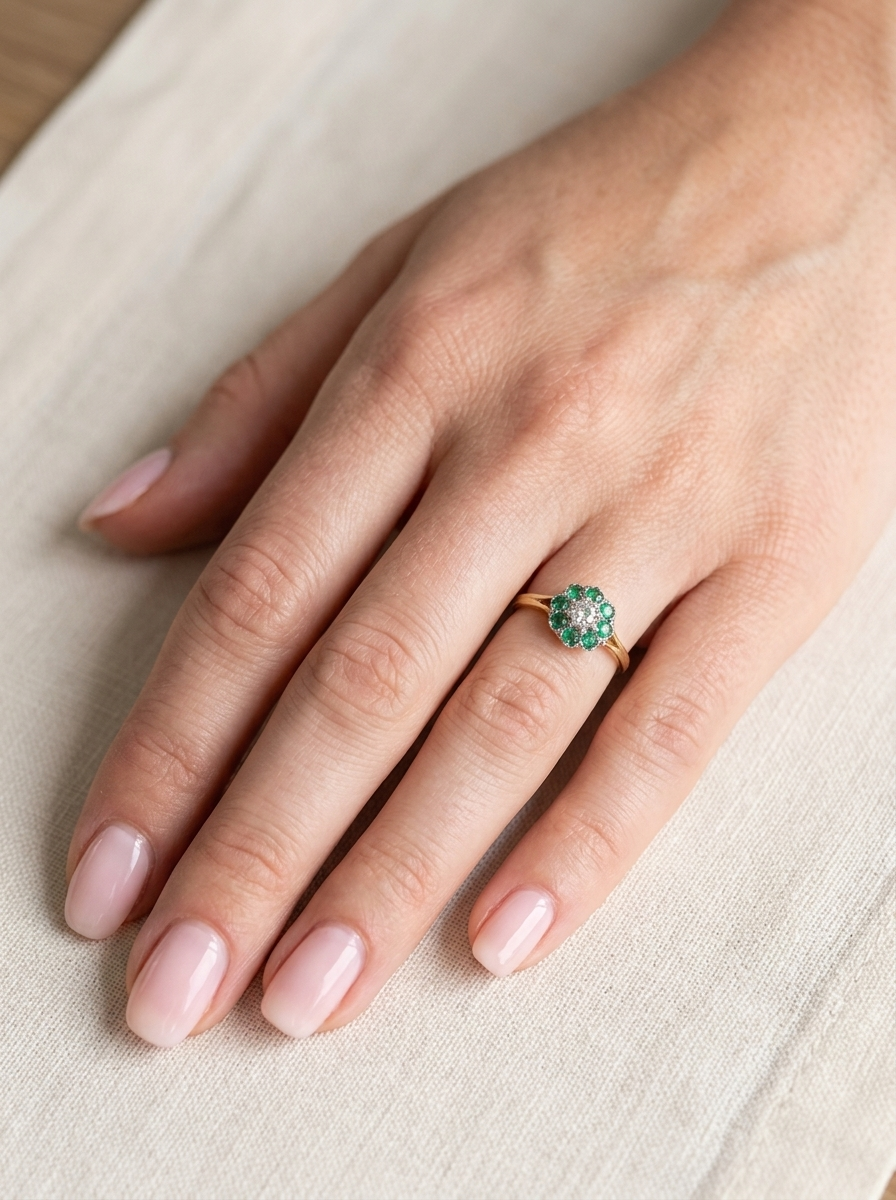 hand A vintage 1960s cluster ring. Principal stone a brilliant cut white diamond, 0.45 carats (5mm diameter)&nbsp;
