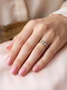 hand A vintage early 20th century trilogy ring. Set with three old cut diamonds, centre stone 3.8mm, and each side a 3.6mm diamond (total carat weight estimated at 0.55 carats)
