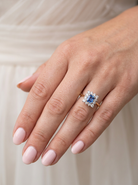 hand A vintage square cluster ring. Features to the centre a square sapphire 5x5mm (est 0.50 carats) mid blue- cornflower hue.&nbsp;
