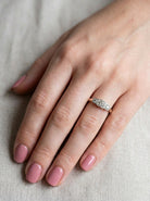 hand A vintage trilogy ring. Set with three old brilliant cut white diamonds, centre 3mm and each side a 2.4mm diamond. Total estimated at 0.20 carats, colour H-j, clarity Si
