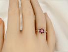 An 18 carat Yellow Gold Diamond and Ruby Cluster Engagement Ring