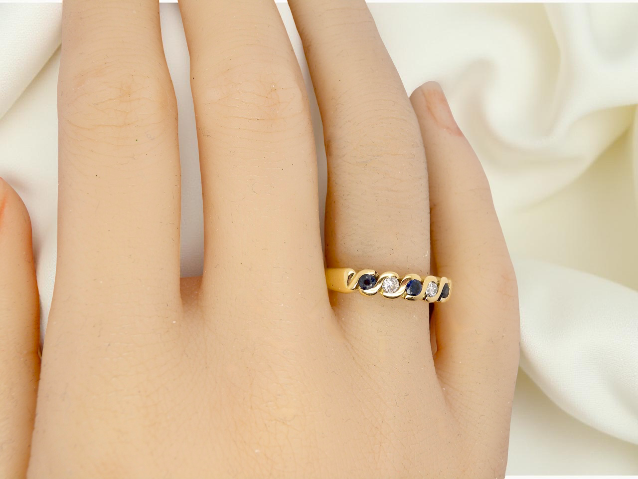 An 18 carat gold Sapphire and Diamond eternity ring