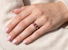 hand An 18 carat gold antique boat shaped ring. Features three lovely coloured wine red rubies, centre 5x4mm, each end 2.4mm.