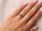 hand An 18 carat gold early 20th century ring set with three sapphires. Centre 5x3.8mm each&nbsp; end 3.8x2.8mm.