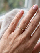 hand An 18 carat yellow gold half hoop diamond eternity ring originally purchased from Goldsmiths 
