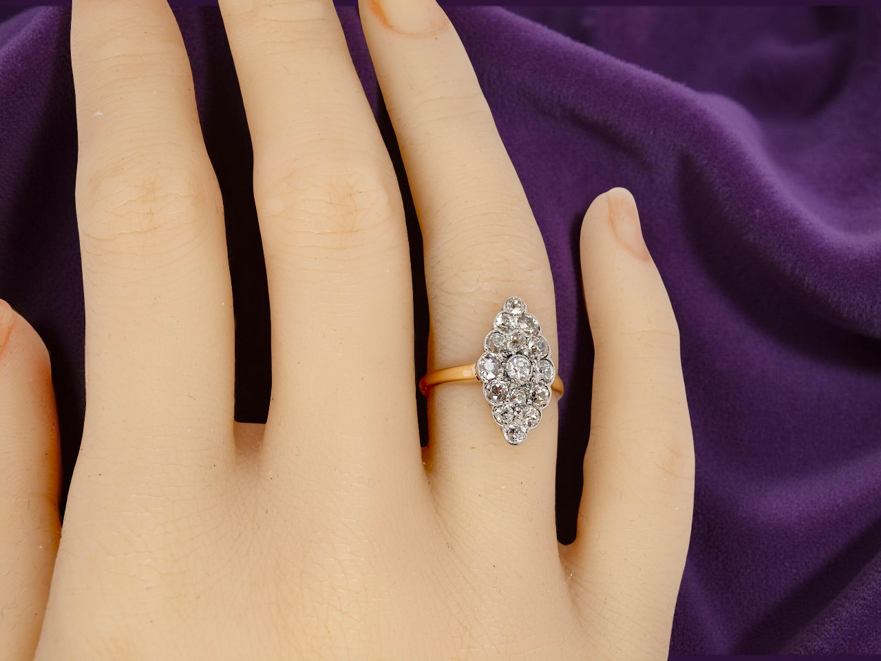  An Antique Marquise shaped Diamond Cluster Ring 