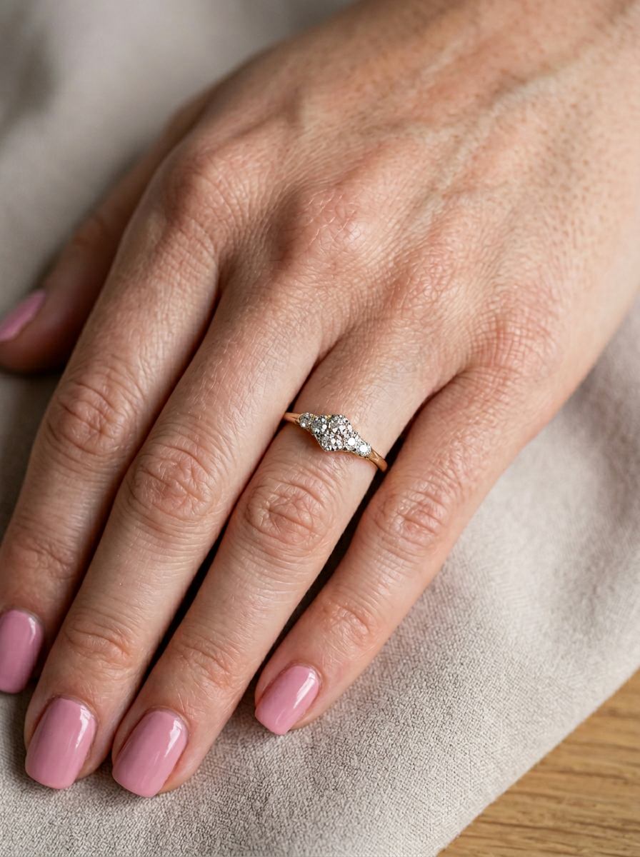 hand An early 20th century ring set with old brilliant cut diamonds.

Centre is set with four diamonds,