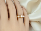 hand An elegant Victorian 18 carat gold* dress ring, set with three cultured pearls 
