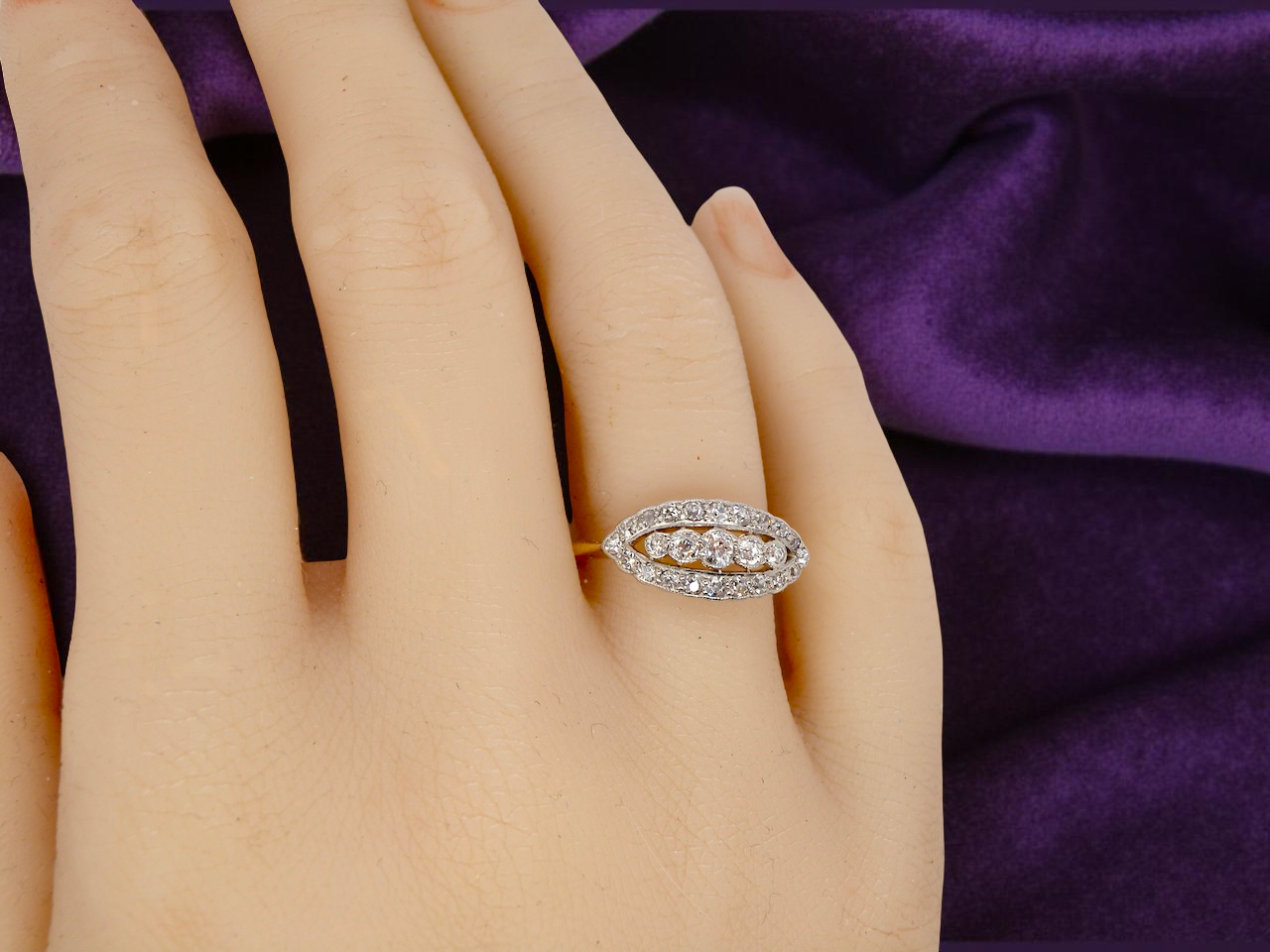 hand An enchanting diamond ring from the early part of the 20th century.