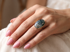 hand An impressive dress ring set with a large moss agate semi precious gem stone.