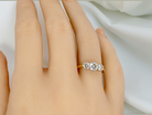 hand The iconic trilogy ring. This example set with three fine brilliant cut white diamonds