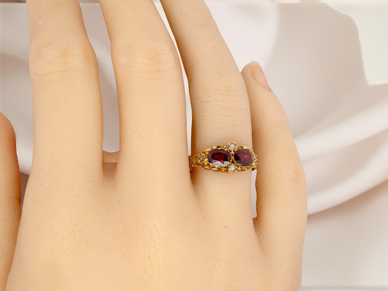 hand  Victorian dress ring, beautifully set with two matching oval-cut garnets 