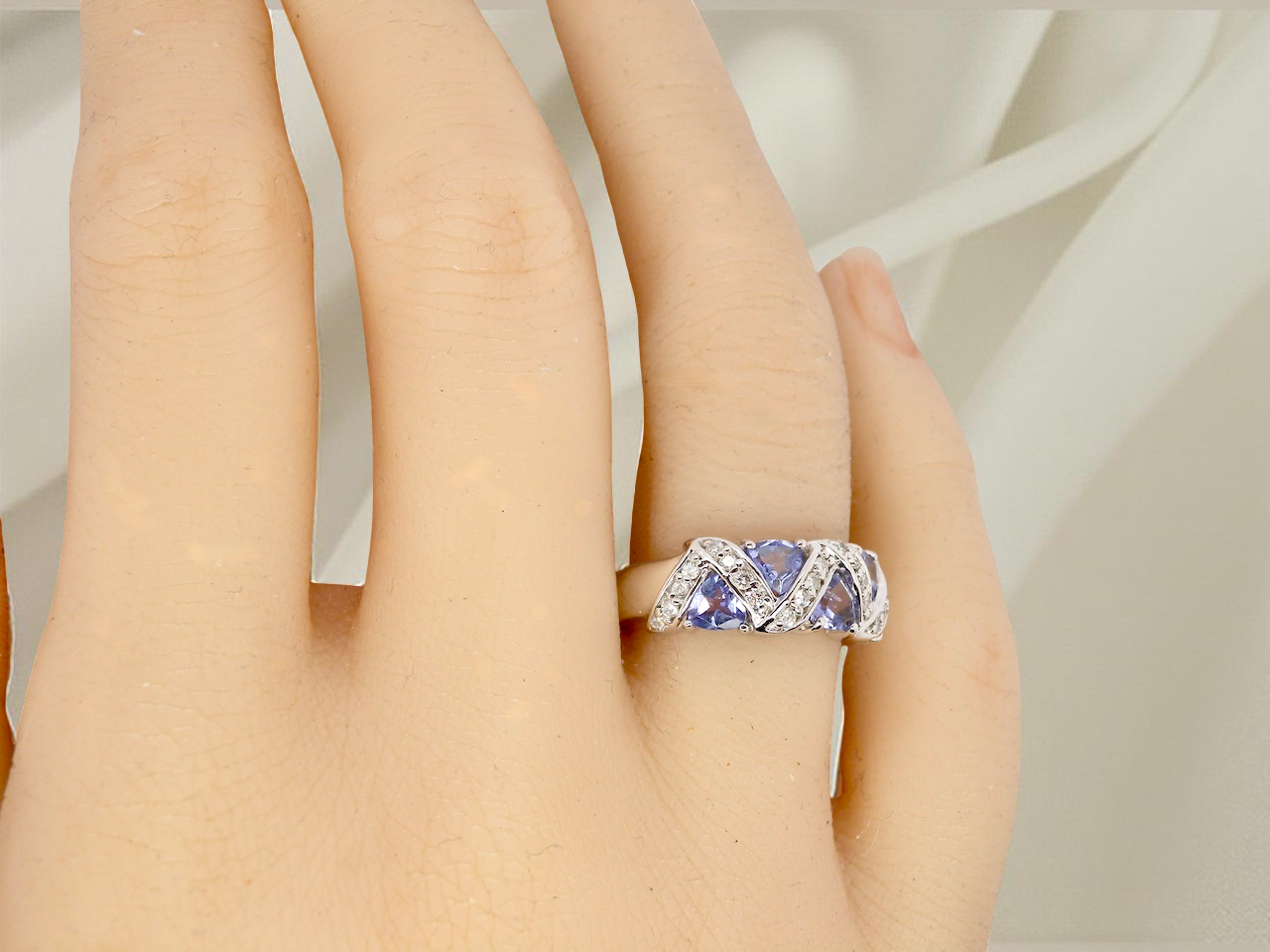 hand beautiful and eye-catching dress ring set in 14ct white gold, featuring five triangular tanzanite gemstones