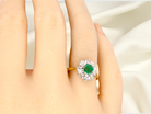 hand  beautiful cluster ring featuring a&nbsp;6mm round emerald 